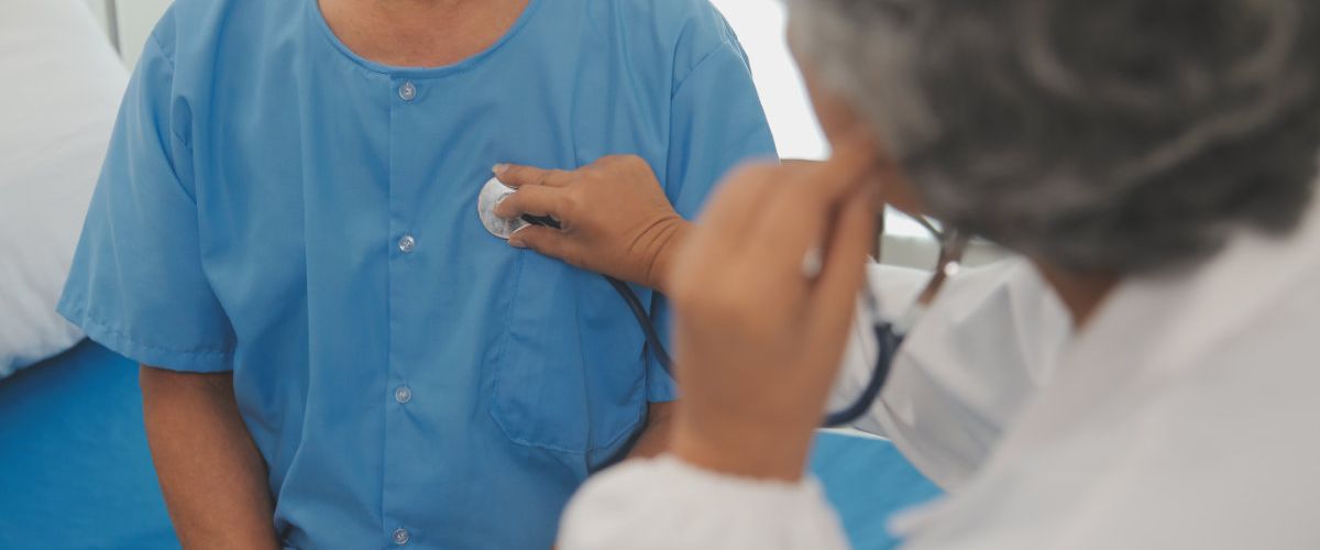 A doctor is examining patient at the clinic.